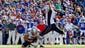 New England Patriots kicker Stephen Gostkowski (3) kicks a field goal to win the game as punter Ryan Allen (6) holds during the fourth quarter against the Buffalo Bills at Ralph Wilson Stadium. Patriots beat the Bills 23-21.