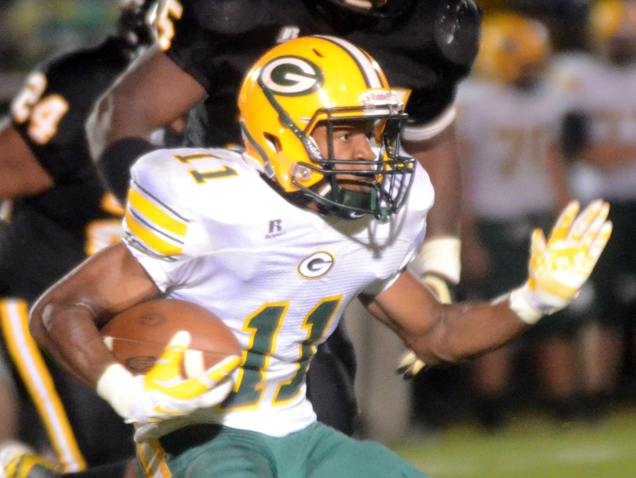 Gallatin High junior Dezmond Chambers carries the football during the second quarter.