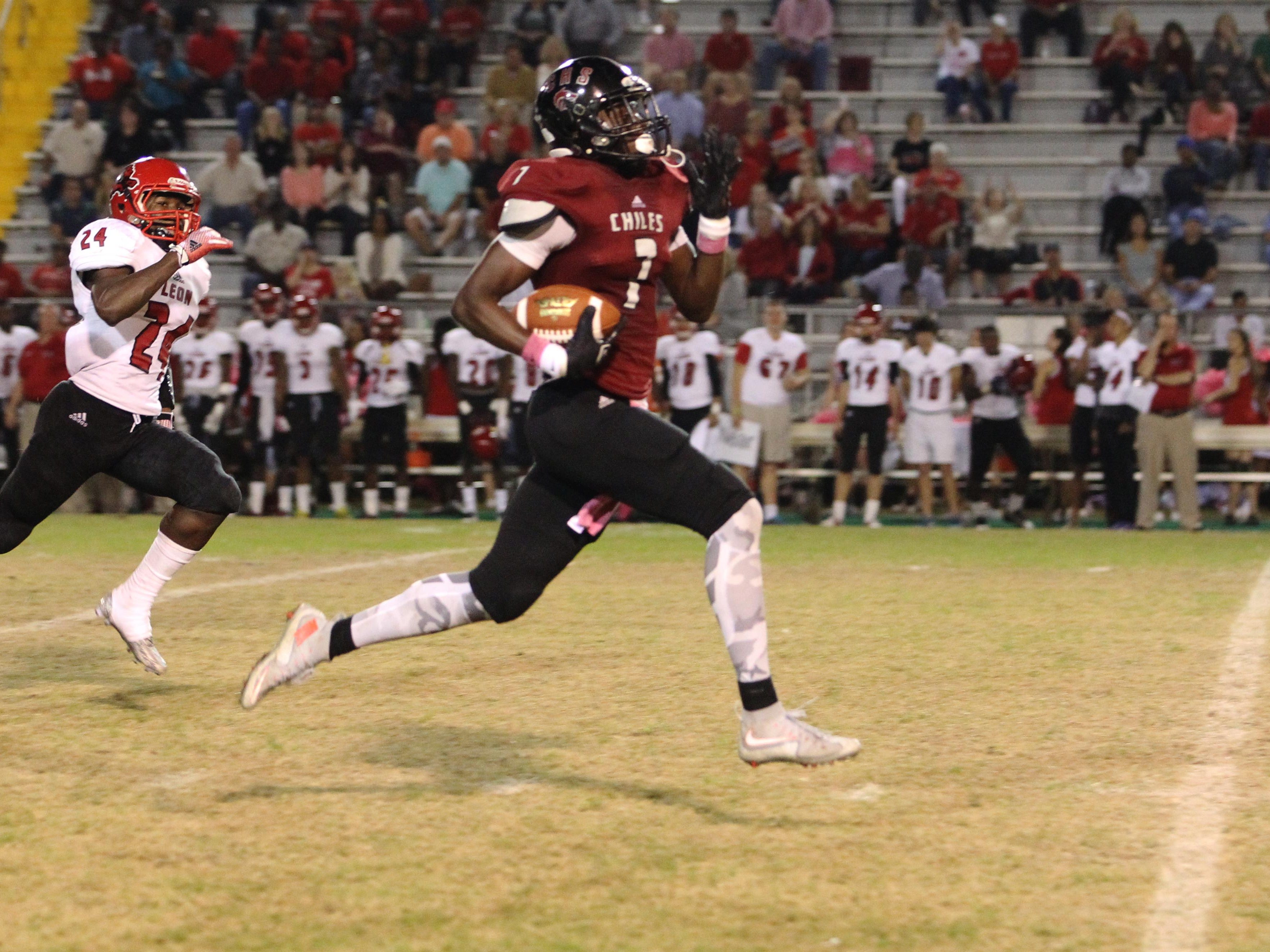 Chiles receiver John Mitchell sprints for an 80-yard touchdown as part of his 4-catch, 156-yard night, however, the Timberwolves were upended by Leon, 22-21, on a game-winning touchdown with 28 seconds left.