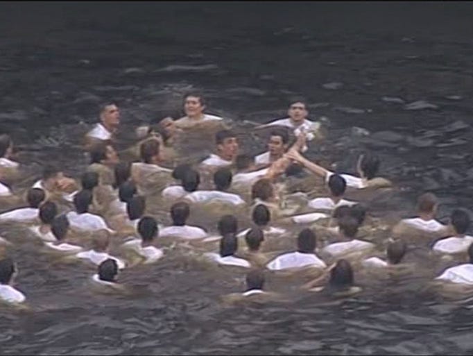 Dozens of young men braved the cold waters for a chance