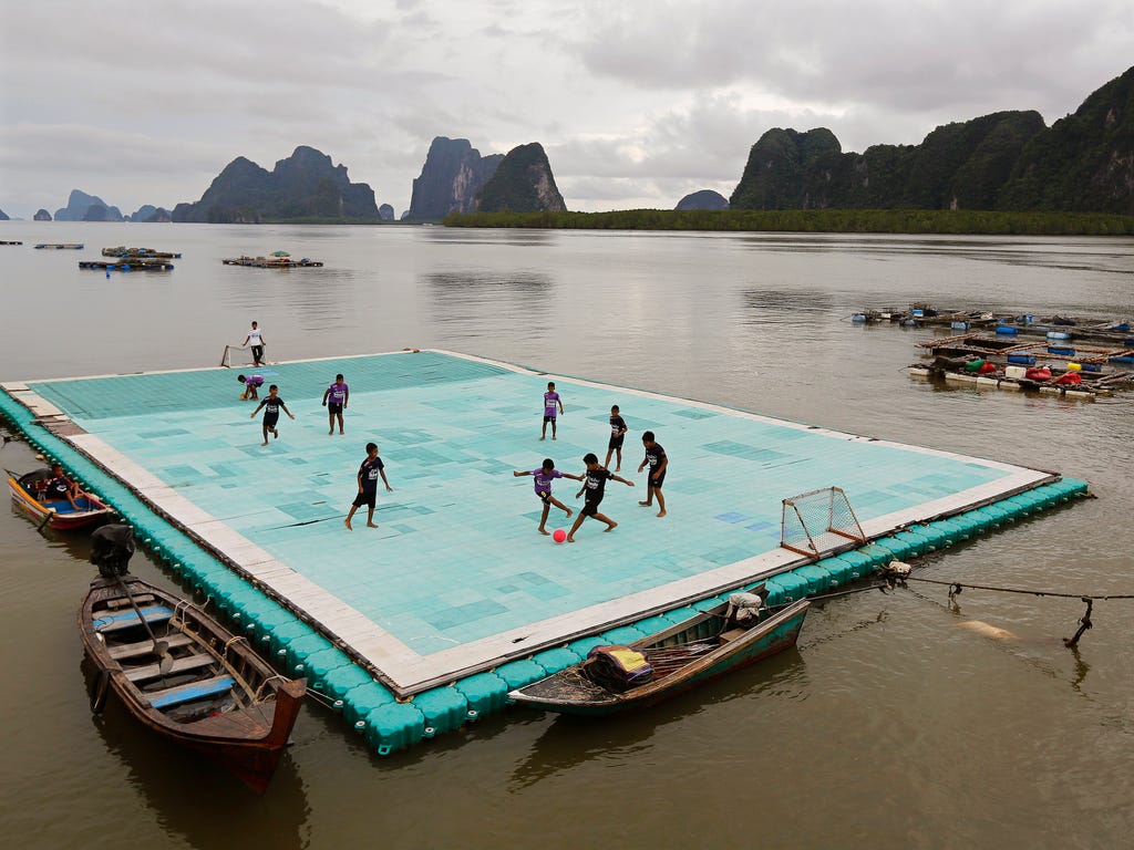 Boys play soccer on a floating football field at the Muslim fishing village of Koh Panyee in southern Thailand. The field was erected for children due to a lack of space on the island.