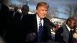 Trump greets people as he visits a polling station