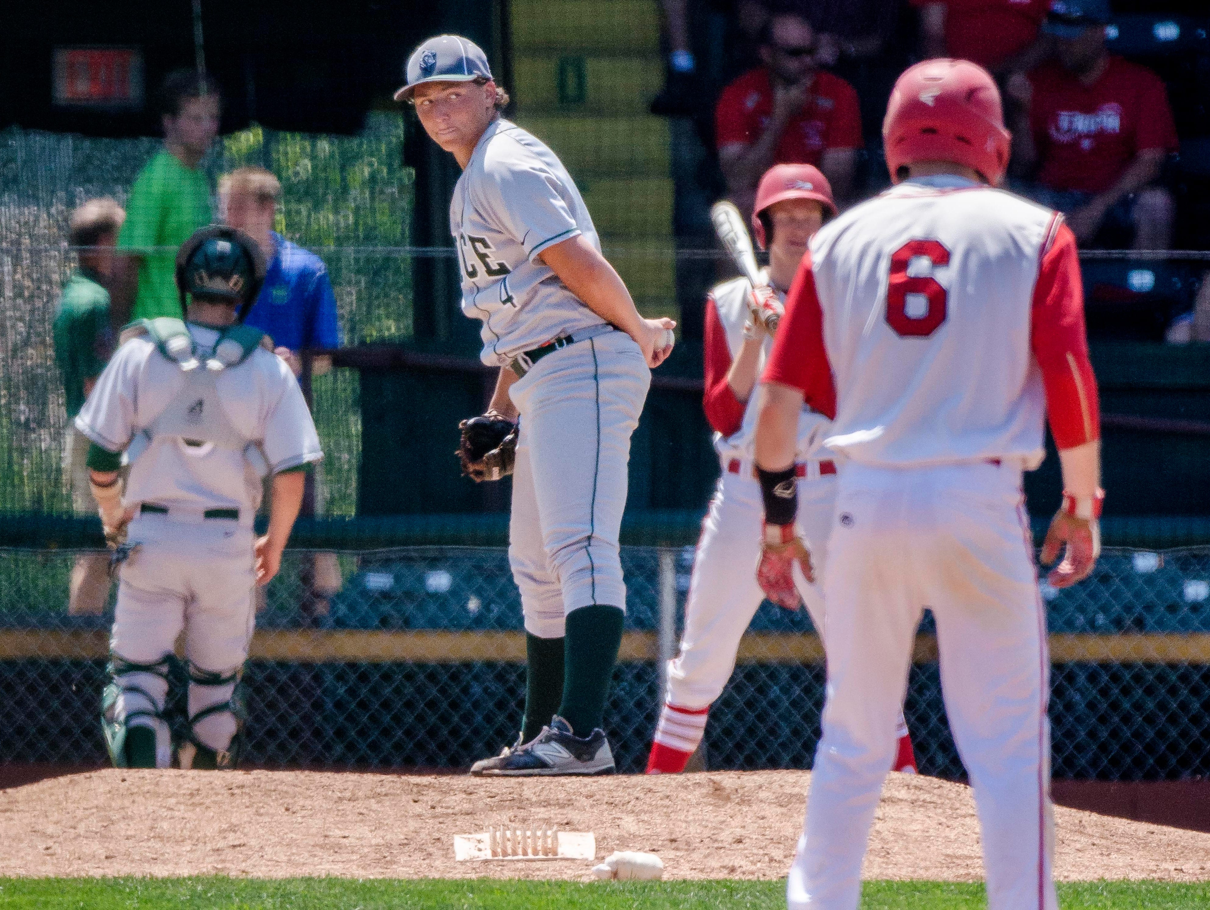 Rice's William Hesslink keeps an eye on the bases against CVU during the Division I state high school baseball championship at Centennial Field in Burlington on Saturday, June 13, 2015.