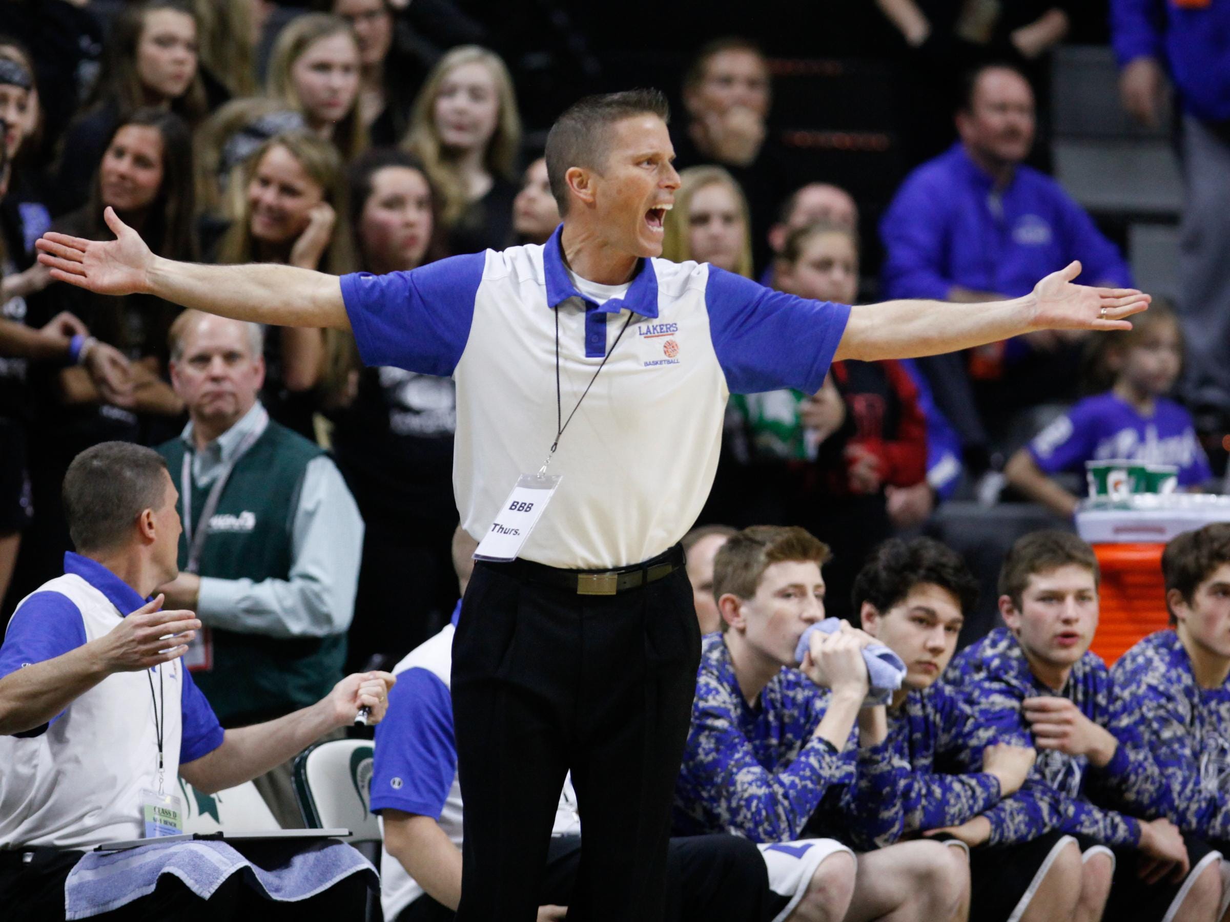 Waterford Our Lady of the Lakes coach Paul Robak disputes a call during the second quarter of the Lakers’ 64-53 Class D semifinal win over Wyoming Tri-unity Thursday at the Breslin Center.
