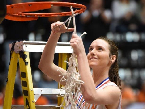 Silverton senior Alia Parsons cuts down the net after the Foxes won the OSAA Class 5A state championship.