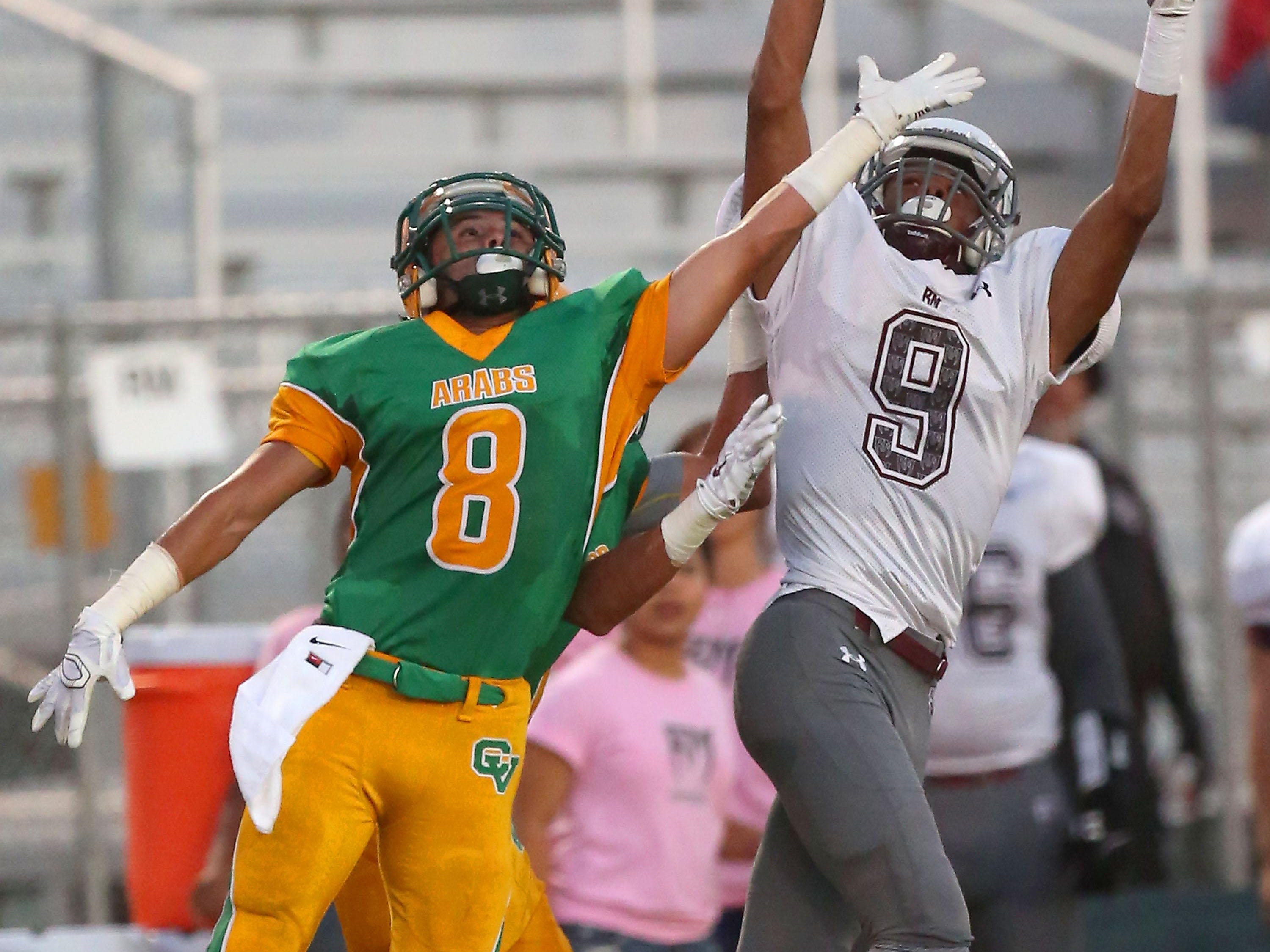 Charles Murrell hauls in a pass for Rancho Mirage’s first touchdown as Willy Ortiz, No. 8, of Coachella defends on Friday.