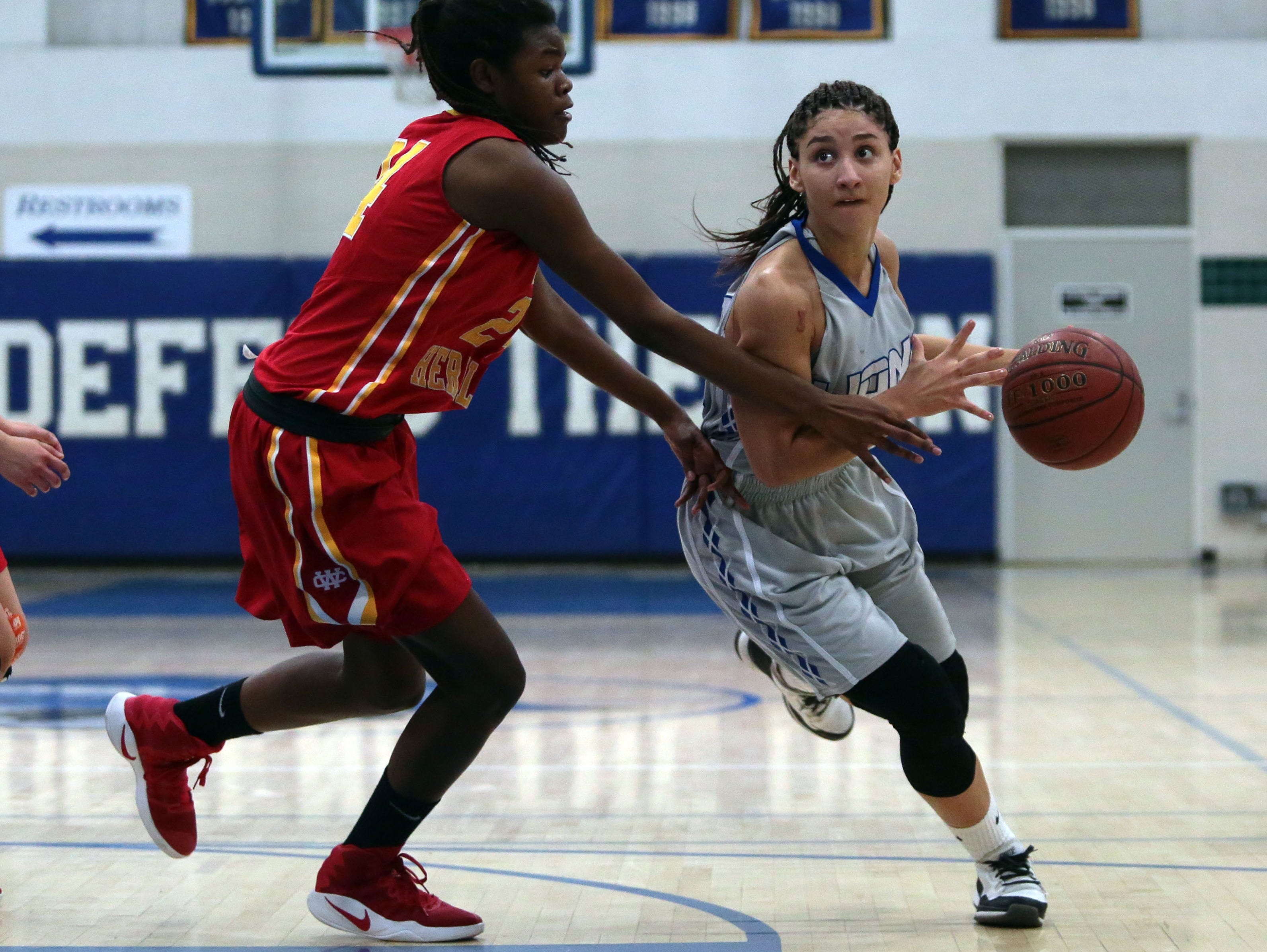 Cathedral City's Le'Anna Broom moves pass Whittier Christian defenders on Saturday, February 18, 2017 in Cathedral City.