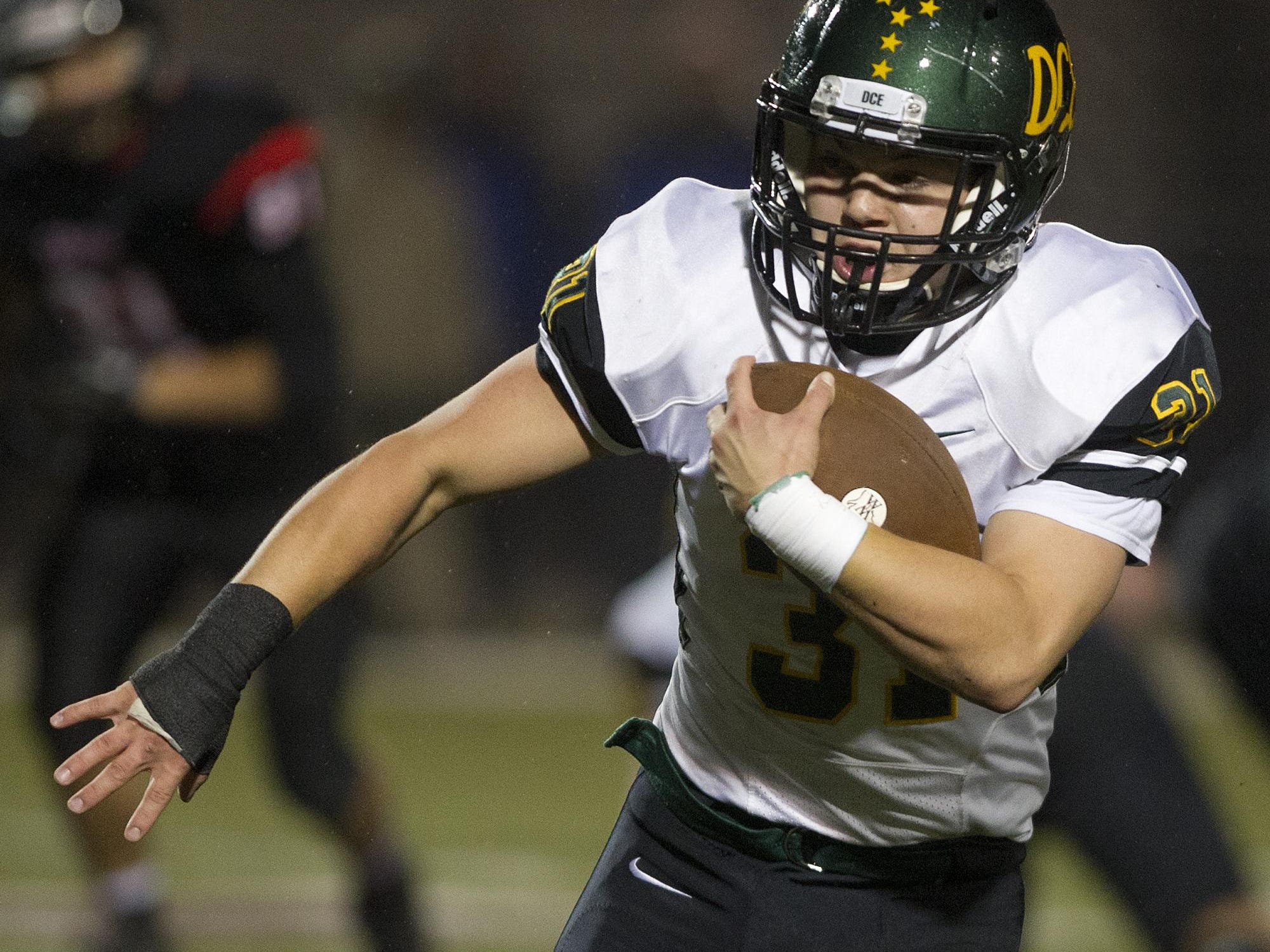 D.C. Everest's Isaac Frieders carries the ball Friday during a WIAA Division 1 playoff game against Stevens Point Area Senior High at Goerke Field in Stevens Point.