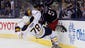 Columbus Blue Jackets defenseman Fedor Tyutin (51) checks Buffalo Sabres right wing Corey Tropp (78) during the first period at Nationwide Arena.