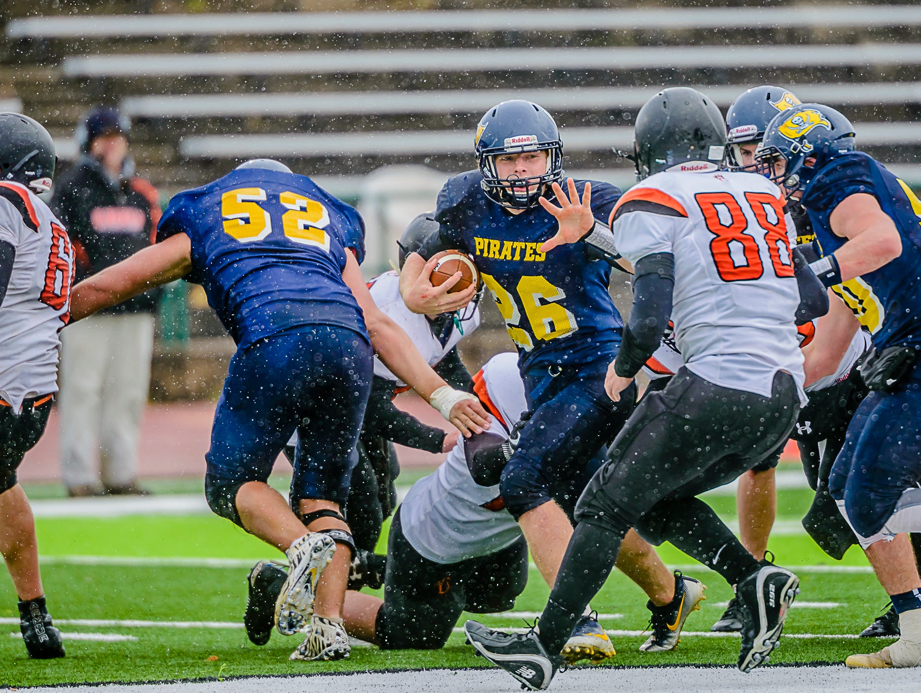 Jared Smith ,center, of Pewamo-Westphalia sets up to stiff arm Ubly defender Colton Rosenthal ,88, on a run for1st down during their Division 7 state semifinal game Saturday November 19, 2016 at Mt. Pleasant High School. KEVIN W. FOWLER PHOTO