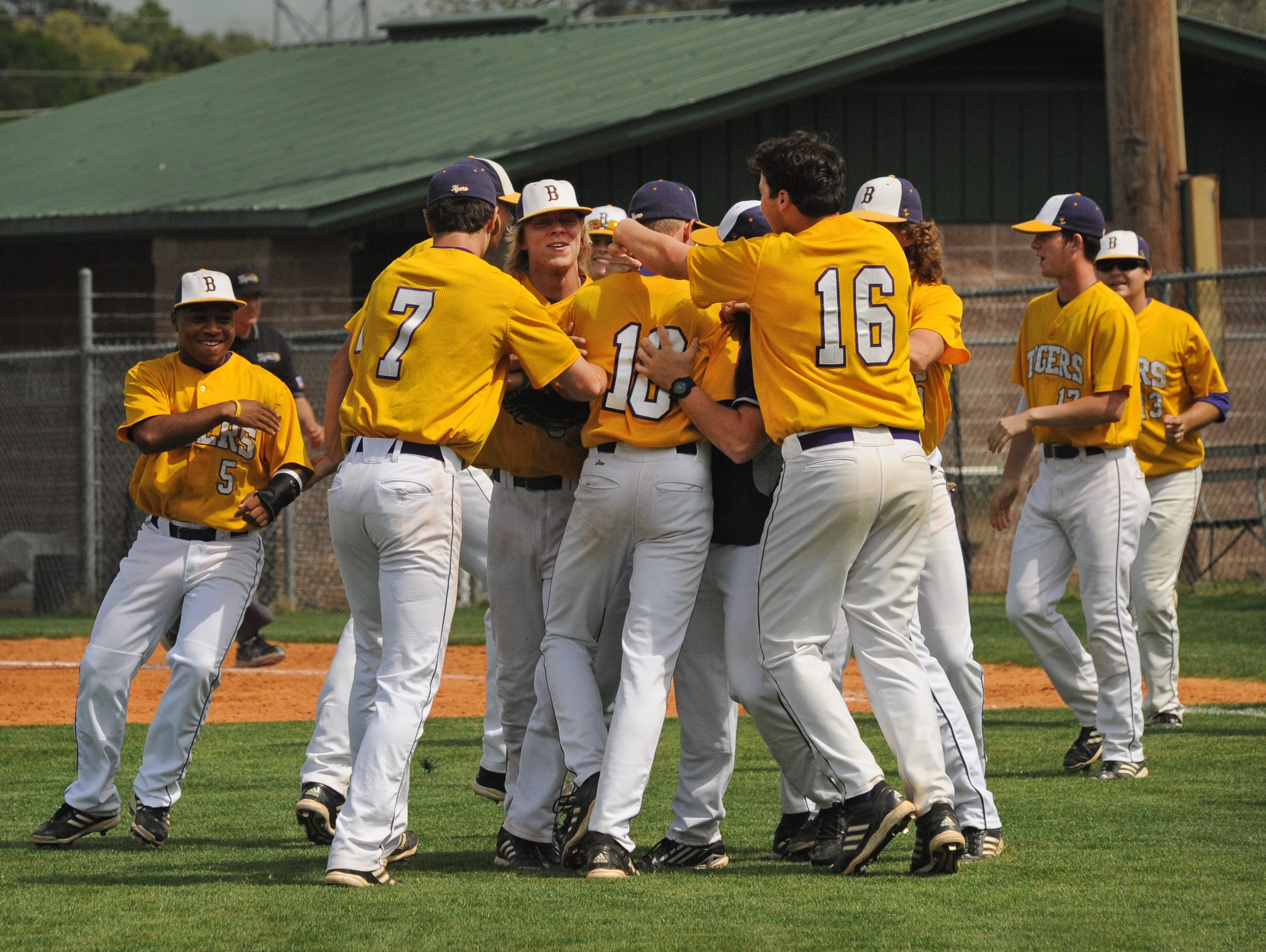 Benton's Jackson Rutledge is congratulated after a 2014 save.