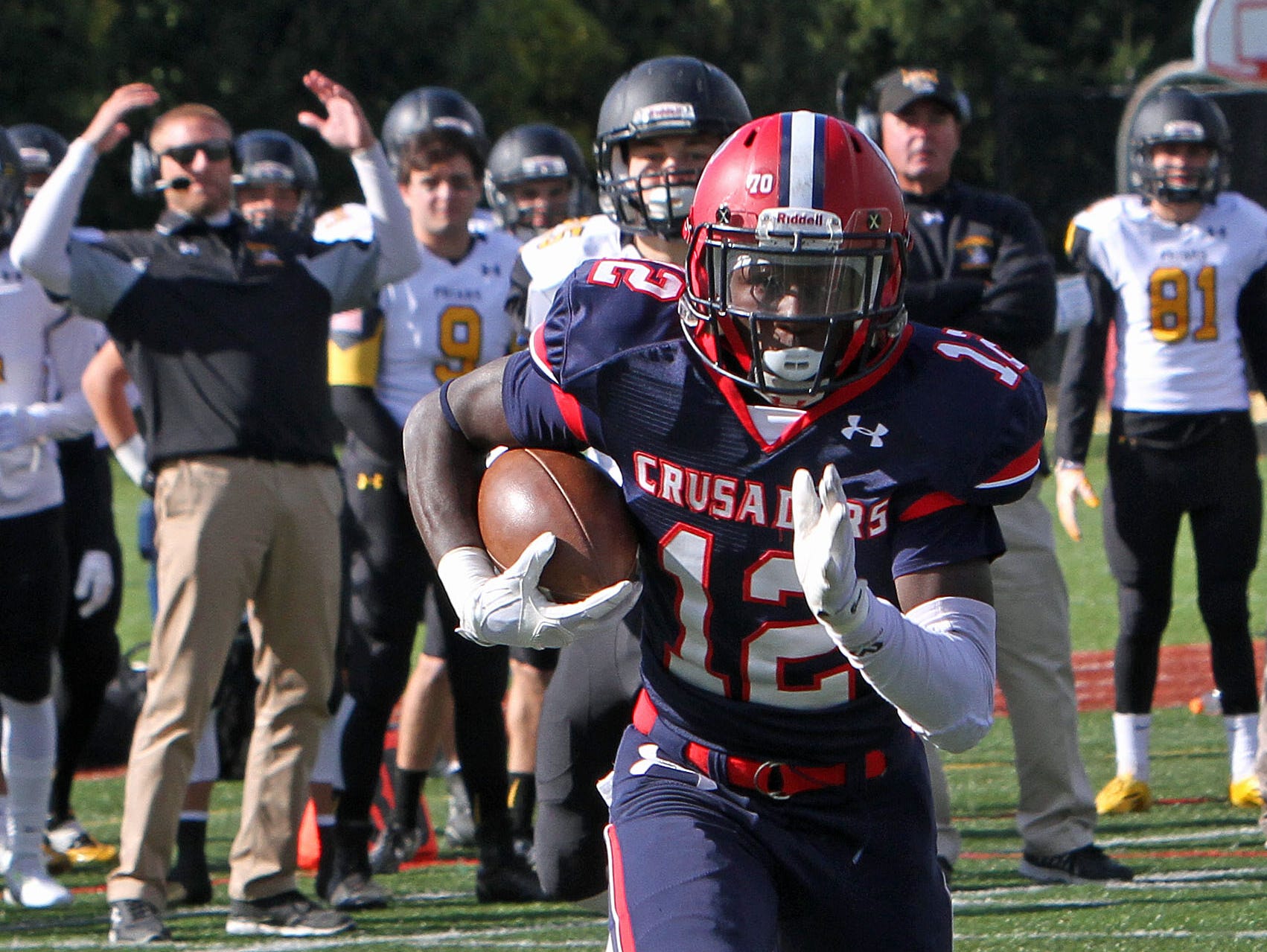 Stepinac's Atrilleon Williams (12) intercepts a pass and runs in for a first half touchdown against Saint Anthony's in a football game at Stepinac High School in White Plains Oct. 17, 2015. Stepinac won the game 49-32.