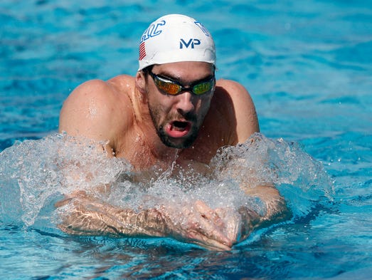 Michael Phelps swims laps during a practice session