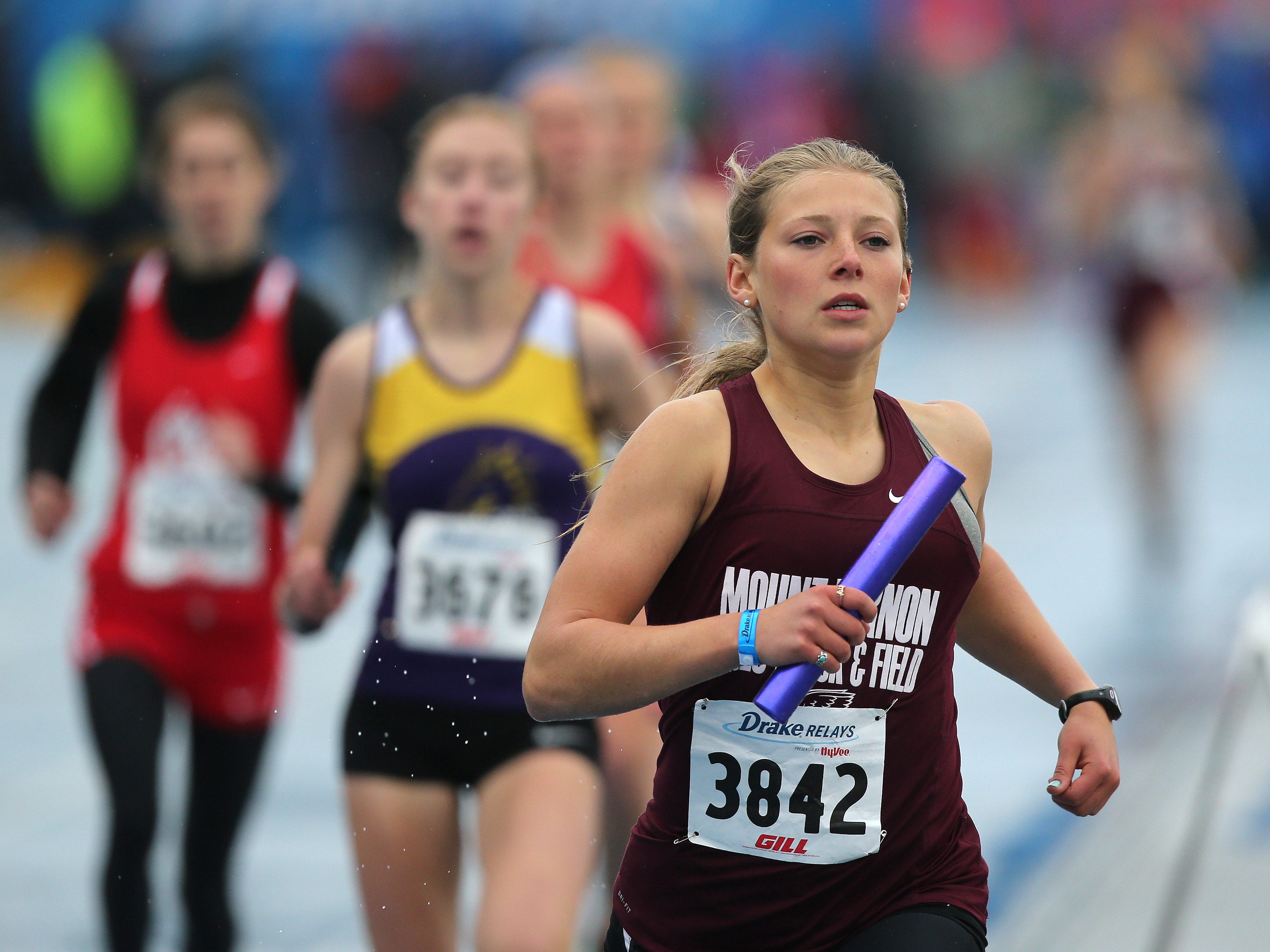 Mount Vernon sophomore Faith Anton runs the baton in the girls 4x800 meter relay during the Drake Relays at Drake Stadium in Des Moines on Saturday, April 25, 2015. Davenport Assumption’s Mallory King took the lead from Waukee in the third leg and Joy Ripslinger extended it for a win in 9:20.99, ahead of last year’s 9:23.78 victory.