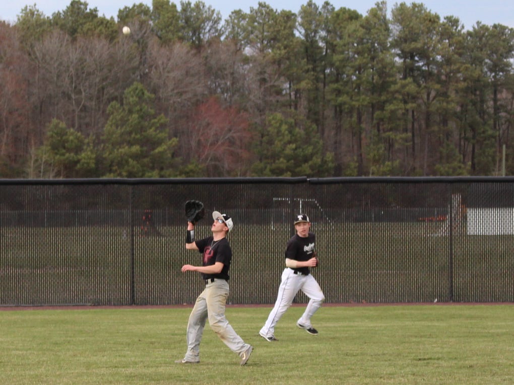 Sussex Tech senior Trey Banning shags a fly ball during practice in Georgetown.