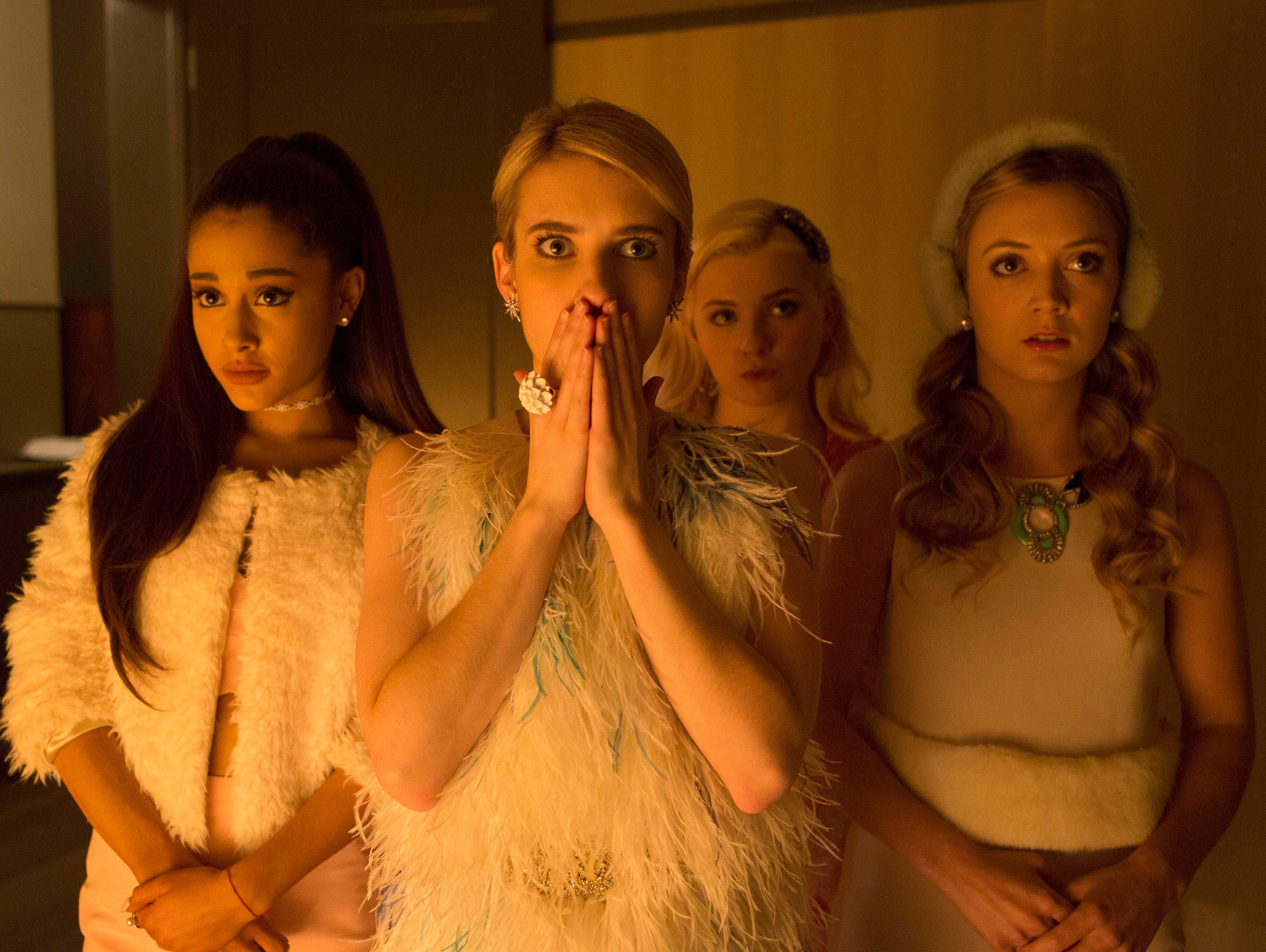 Emma Roberts, with Ariana Grande to her left, plays the head of a sorority in Fox's 'Scream Queens.