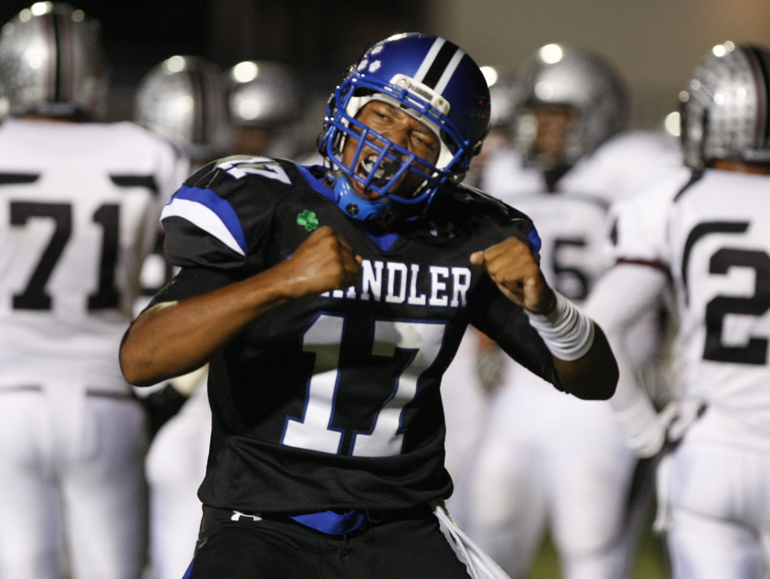 Chandler High quarterback Brett Hundley celebrates after scoring a touchdown against Hamilton High during the 2010 season.
