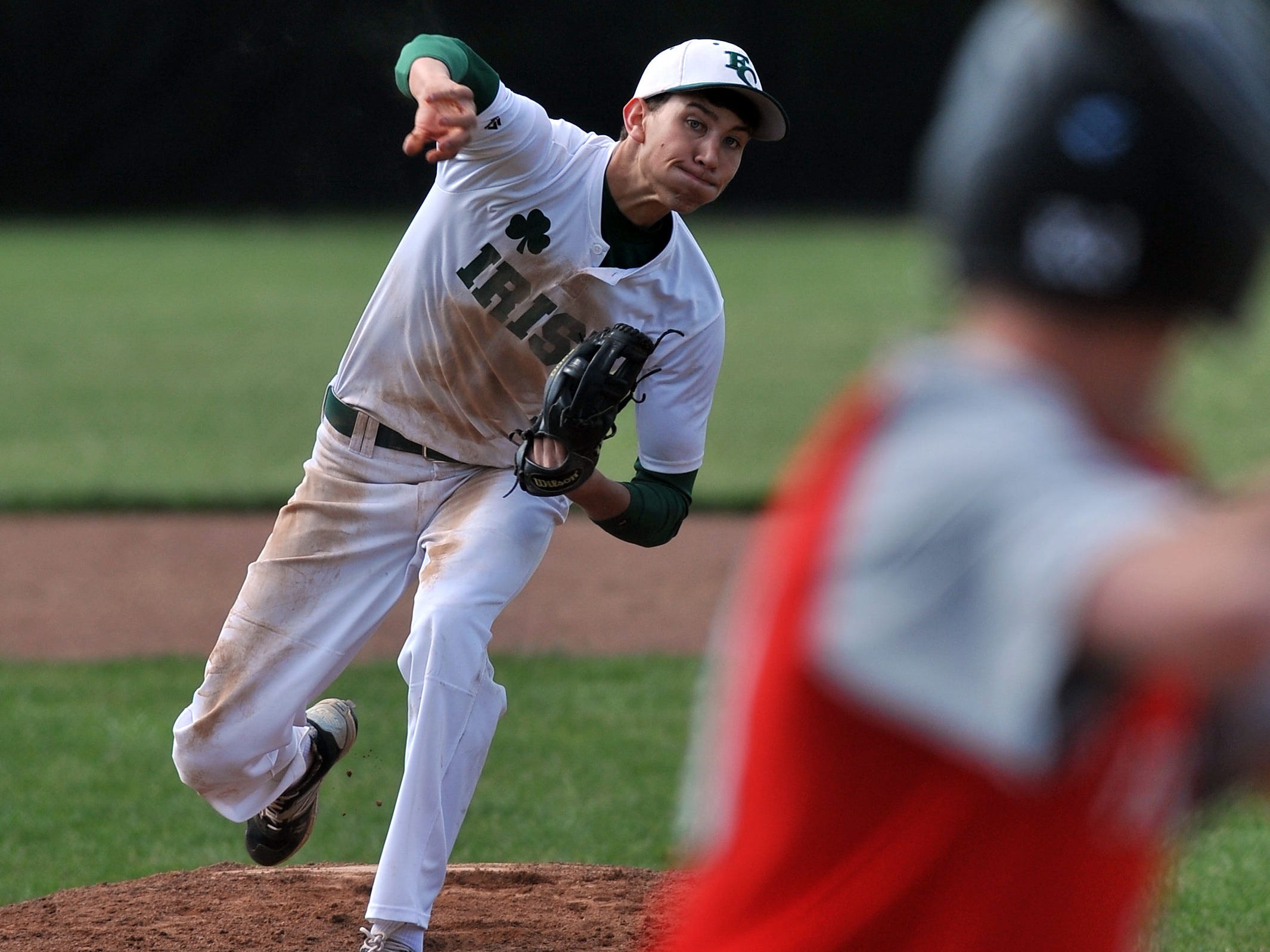 Fisher Catholic’s Jared Faulkner pitches during Wednesday’s game in Lancaster. The Irish won the game over Fairbanks 3-2.