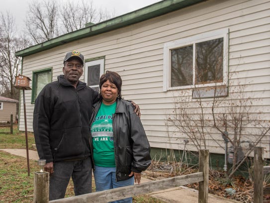 Levi and Teresa Jenkins in front of their new home
