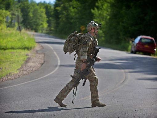An officer leaves the operations command post at Titus
