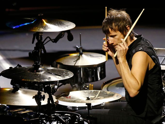 Dominic Howard of Muse performs their Drones Tour to