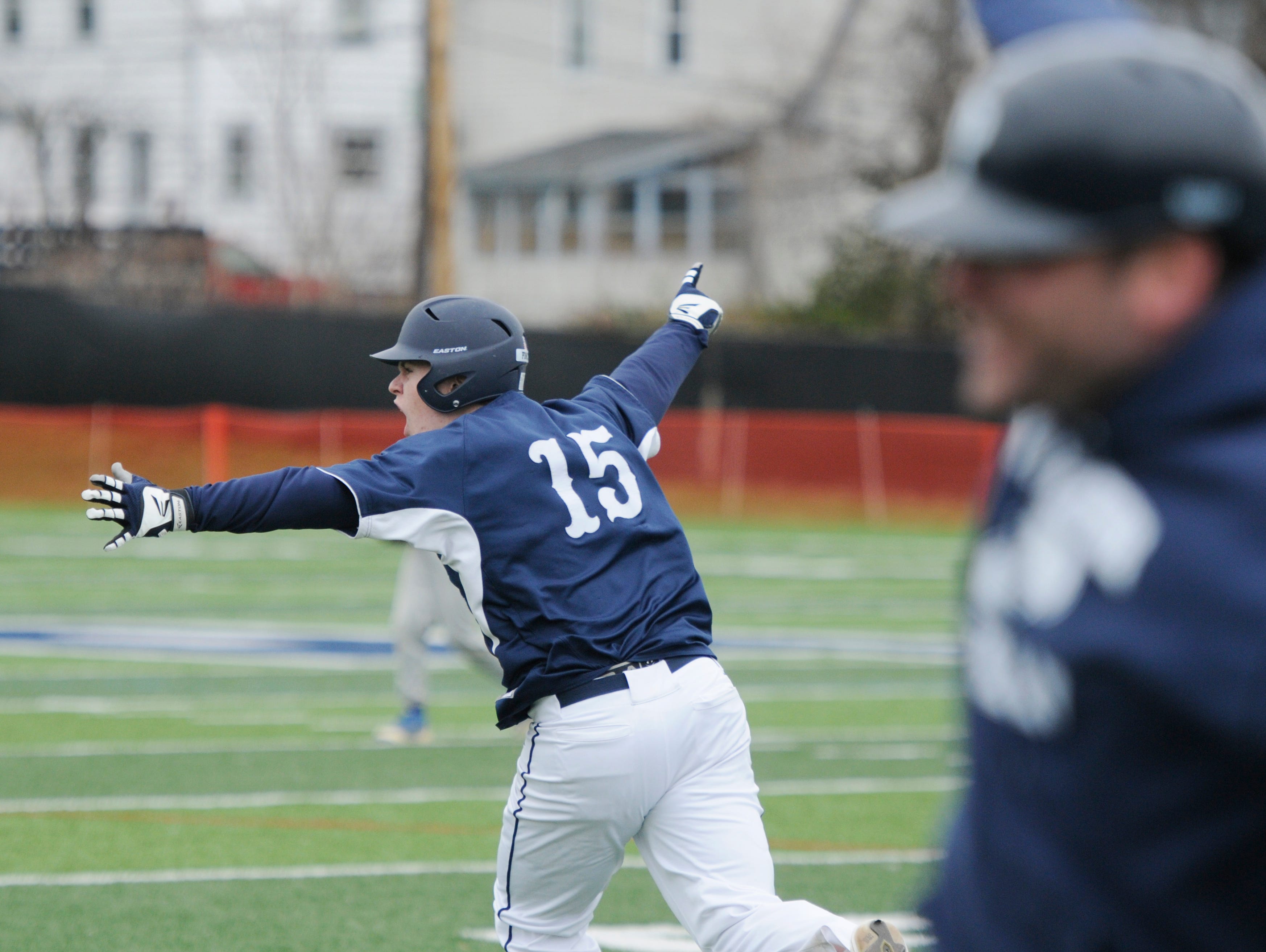 Poughkeepsie's Cullen O'Shea celebrates hitting a grand slam home run in the sixth inning of Saturday's game versus Rhinebeck at Poughkeepsie High School.