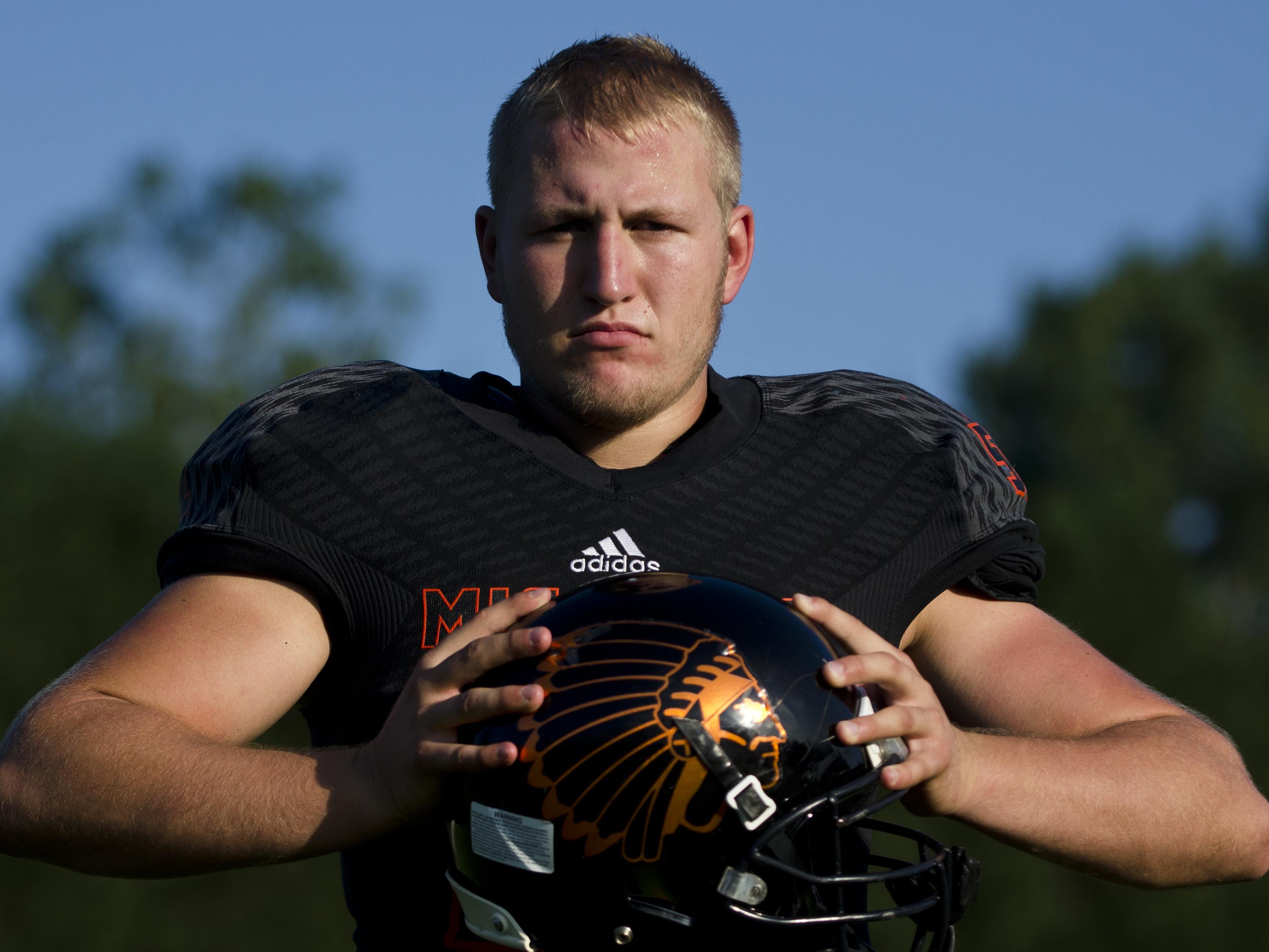 Mishicot High School defensive lineman Erik Morreau, 17, described himself as a "madman" on the field and coach Kevin Fix said he could be "very physical" during the game.