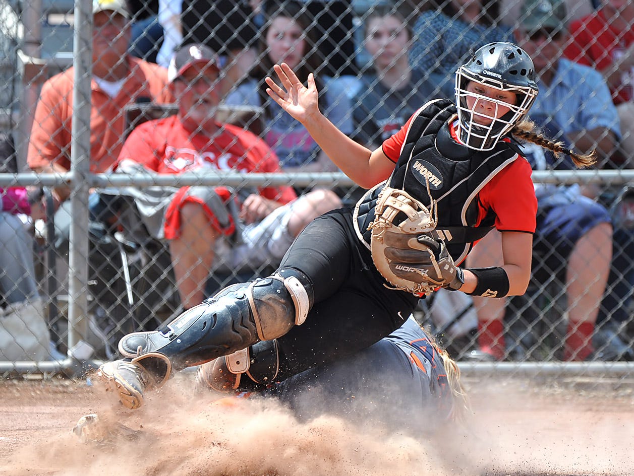 Stewarts Creek catcher Ciera Dobbins goes down after a close play at home during the Lady Red Hawks 4-2 loss to Dickson County in the AAA State Championships at Spring Fling 2016 Wednesday, May 25, 2016 in Murfreesboro, Tenn.
