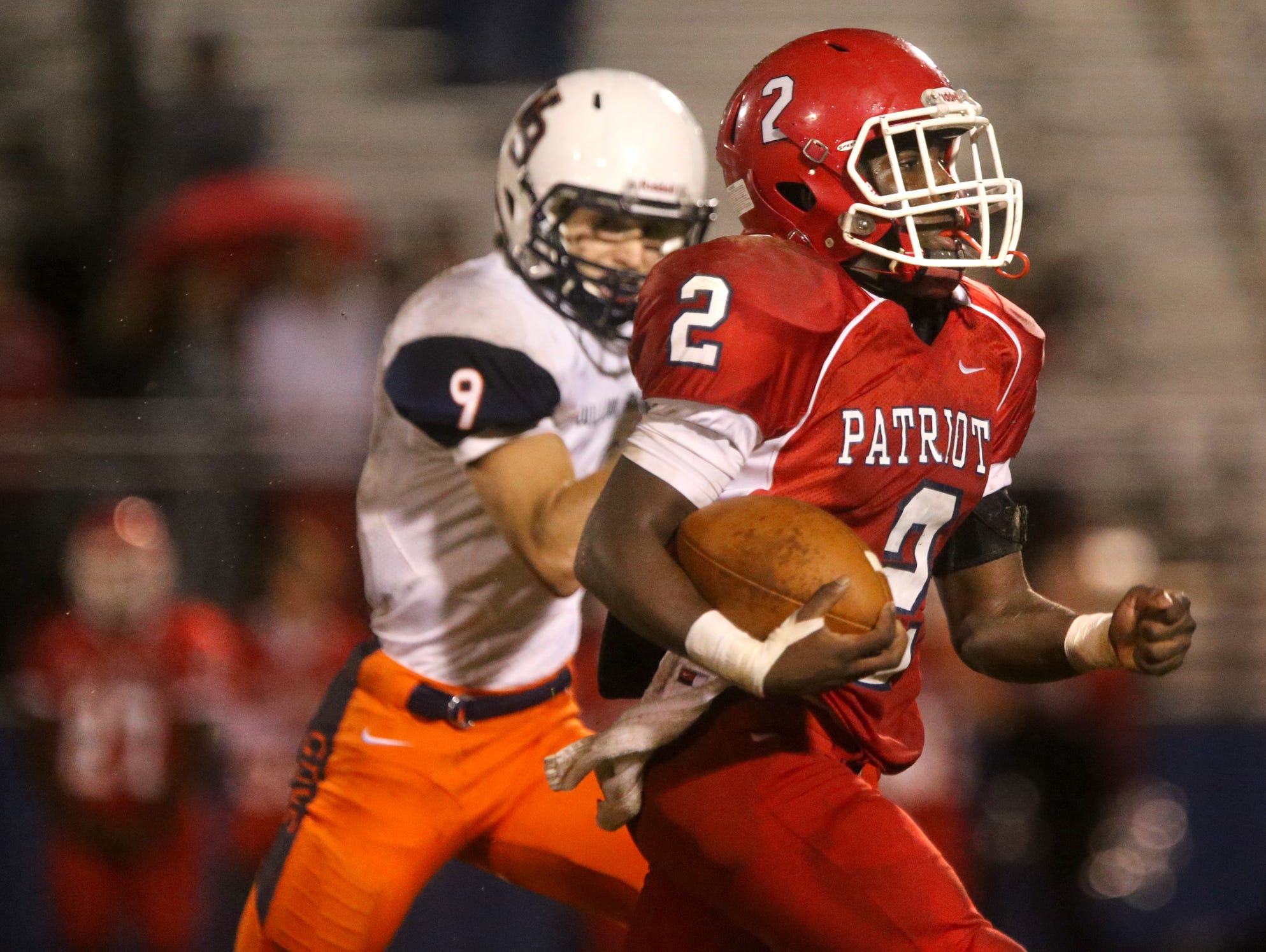 Oakland's Mark Pruitt (2) runs the ball in for a touchdown as William Blount's Seth Gilchrist (9) tries to catch Pruitt during the first round of playoffs, at Oakland, on Friday Nov. 6, 2015.