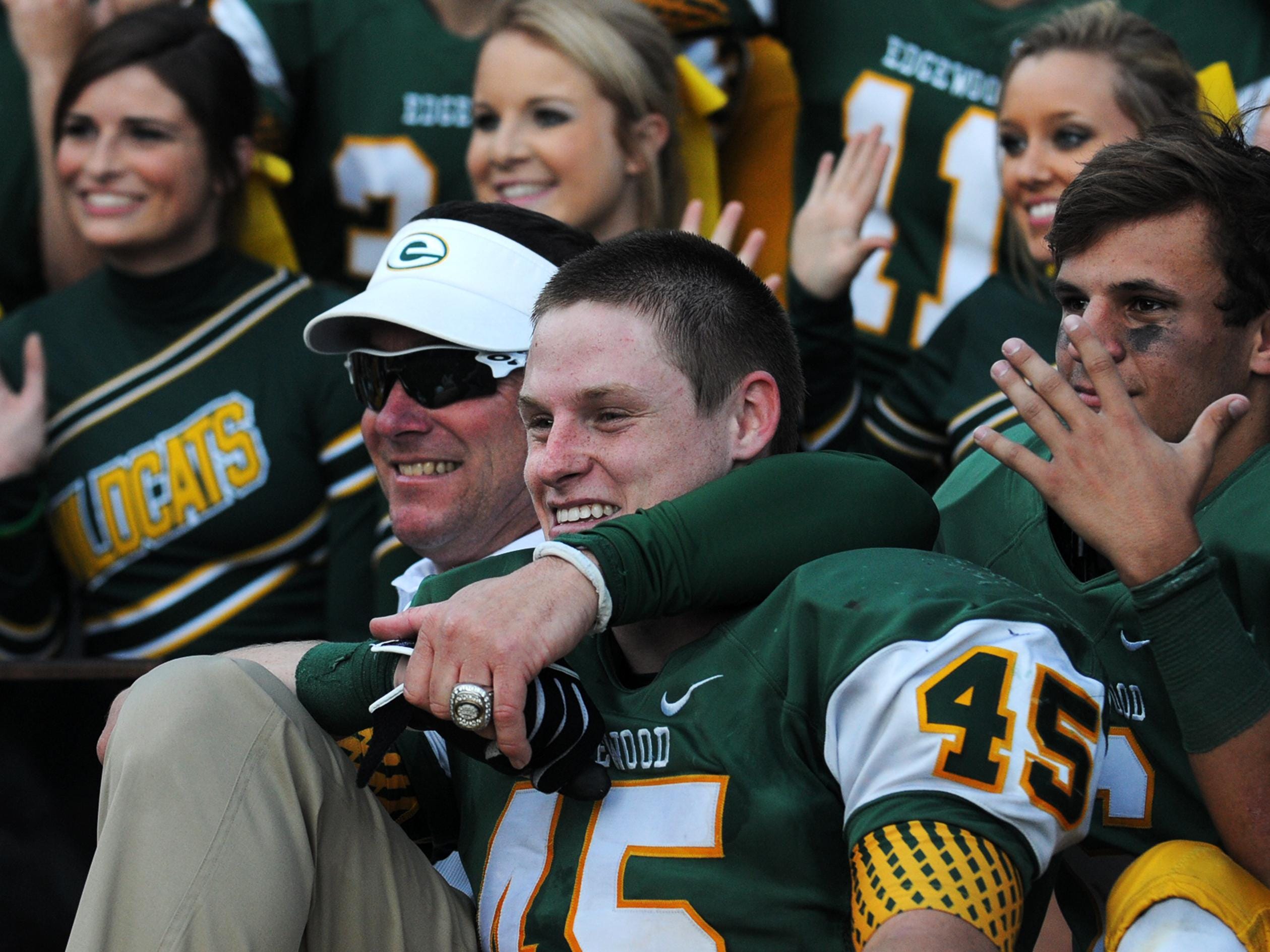 Edgewood coach Bobby Carr celebrates with Jesse Benton (45) after defeating Marengo Academy in the AISA Class AA Championship Game in Troy last year.