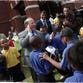 
Detroit Mayor Mike Duggan cheers on students from Henry Ford Academy who are taking part in a soccer clinic after the announcement of a new citywide soccer league that will be open to all public, private and charter elementary schools in Detroit. 
