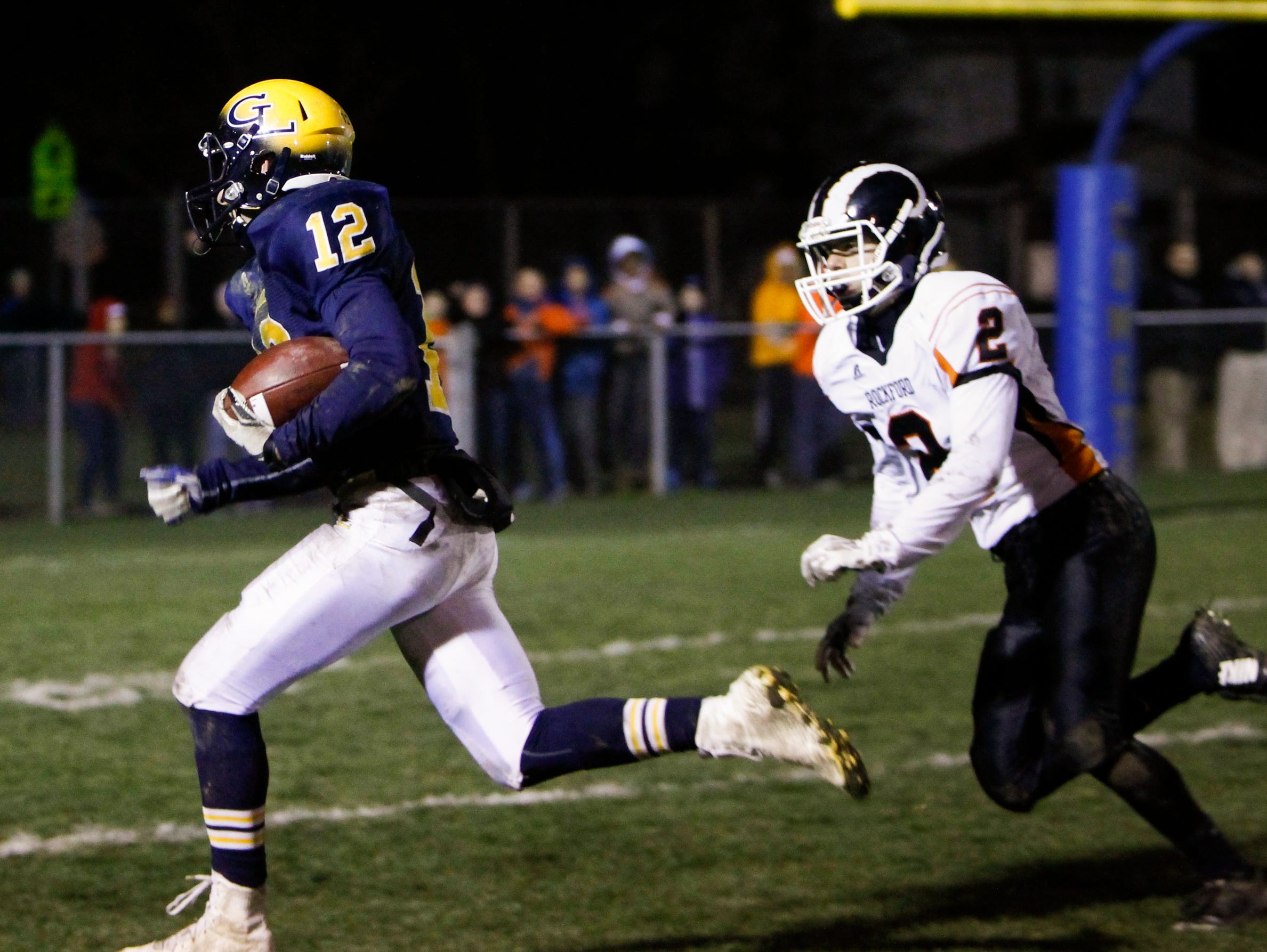 Grand Ledge senior Luke Lalumia heads into the end zone for a touchdown, tying the score 16-16 in the fourth quarter against Rockford Friday, November 13, 2015, during the Div. 1 regional final at Grand Ledge. Grand Ledge won 36-16.