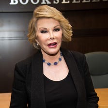Joan Rivers, promoting her book in July, has been rushed to the hospital, reports say.