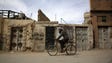 A man rides his bicycle in the al-Qaboun rebel-held