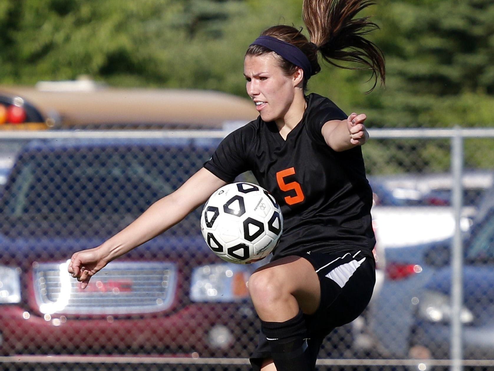 Leslie's Abigale Bowers controls the ball against Jackson Lumen Christi in their soccer regional game, Wednesday, June 3, 2015, in Williamston, Mich.