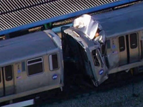 Two train cars are damaged after two Chicago Transit Authority trains on the Blue Line collided during rush hour Sept. 30 in Forest Park, Ill.