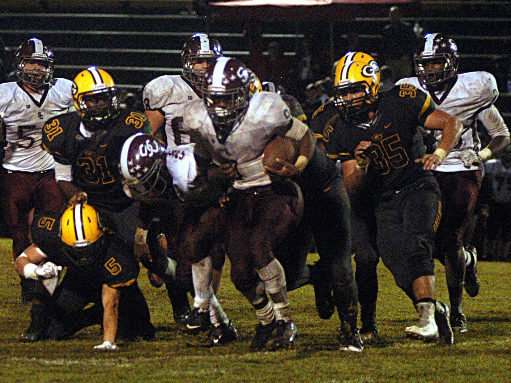 Station Camp sophomore tailback Sirtavious Perry fights for extra yardage during the third quarter of Friday’s game at Gallatin. Perry scored two touchdowns in the Bison’s 27-19 victory.