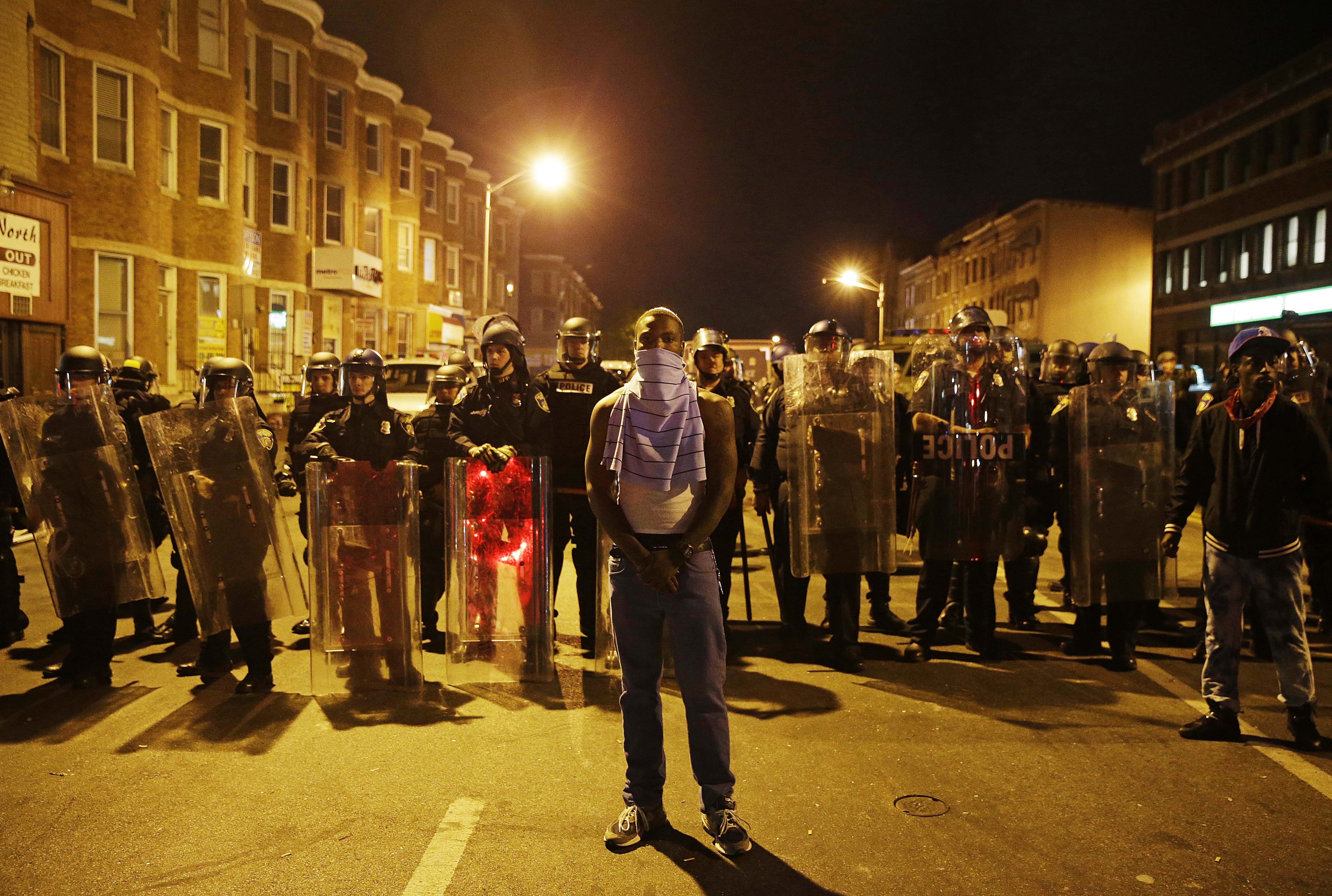 Curfew begins in riot-torn Baltimore