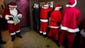 Men dressed as Santa Claus use the restroom at a bar during the SantaCon event on Dec. 14 in Vancouver, British Columbia. SantaCon is held in 300 locations in 44 countries.