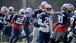New England Patriots players participate in a drill