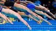 Caeleb Dressel (Florida cap) and swimmers enter the