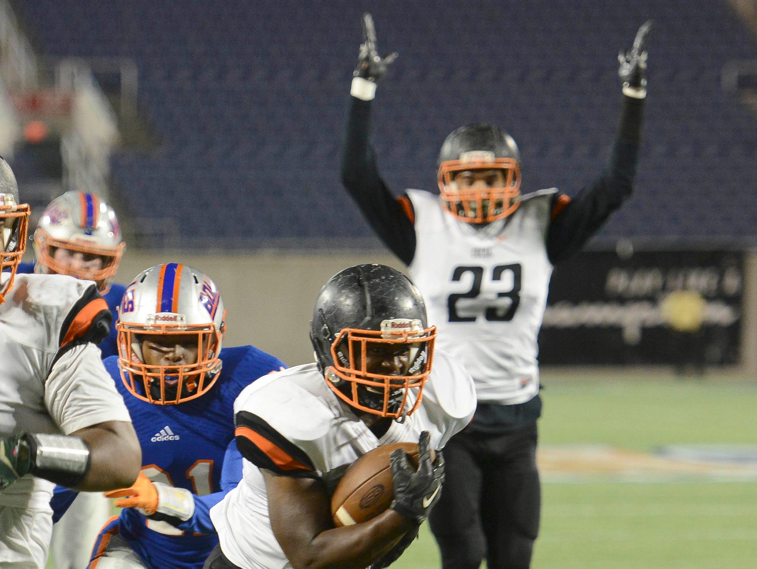 Lasedrick King of Cocoa scores a TD during Thursday's Class 4A championship game in Orlando.