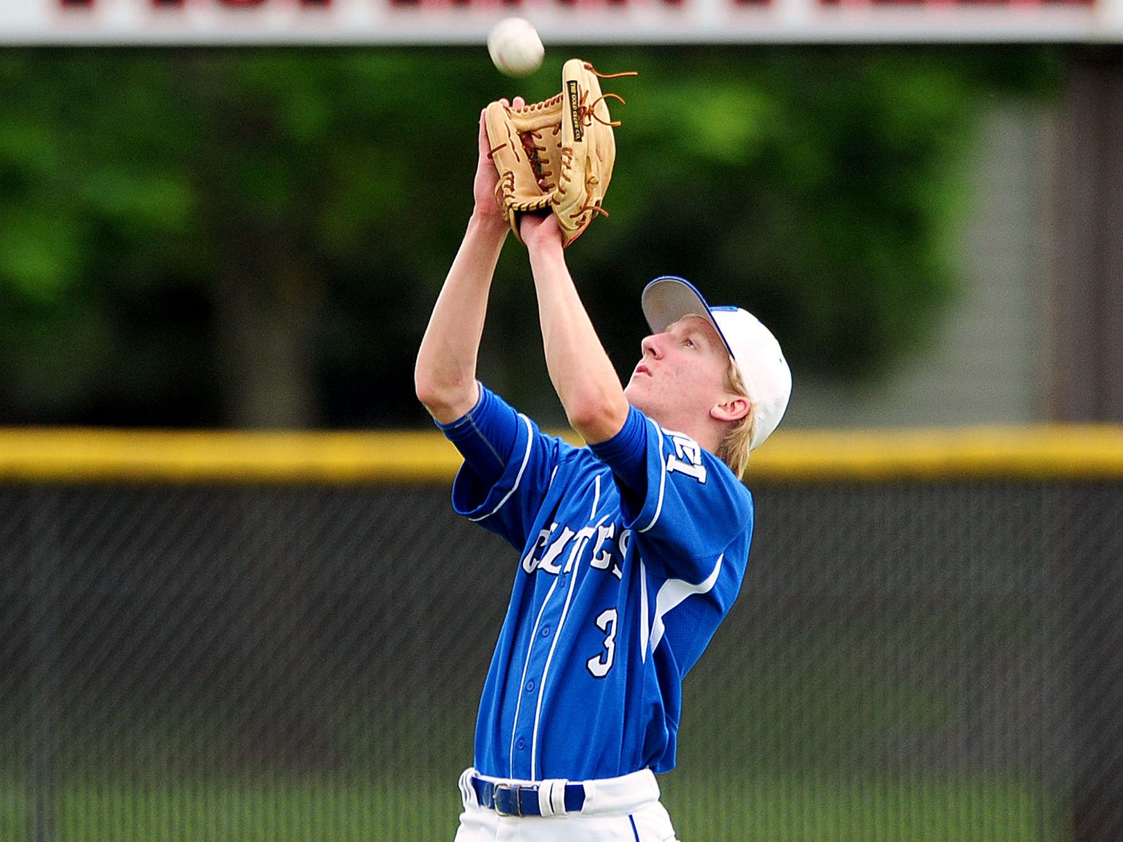 McNary center fielder Jacob Vasas catches a fly ball against McMinnville, on Wednesday, May 13, 2015, in McMinnville.
