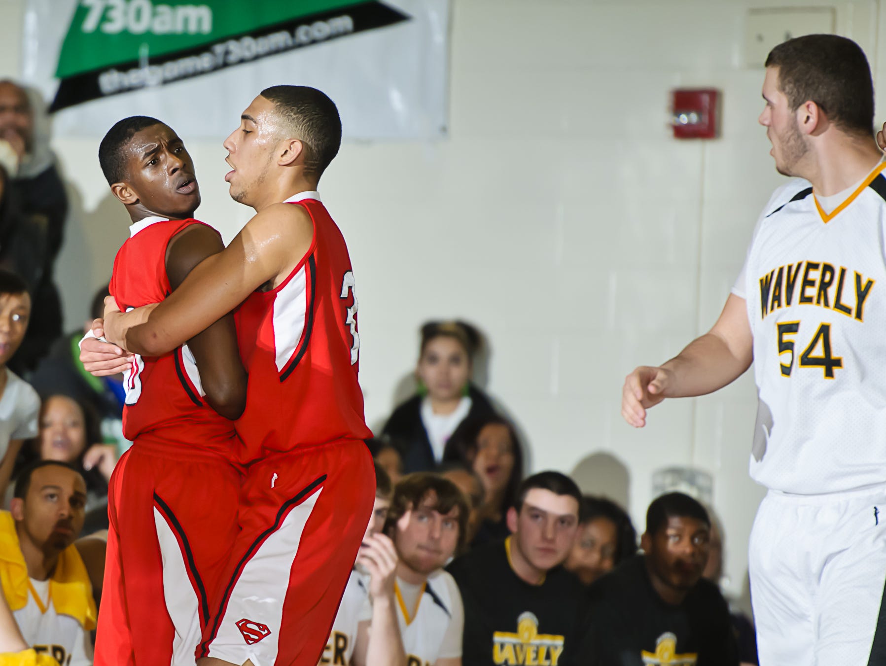 Denzel Valentine (second from left) holds back Sexton teammate teammate Donyae Logan (left) as the trash talking with Ramadan Ahmeti (right) of Waverly becomes intense during a game in 2011.