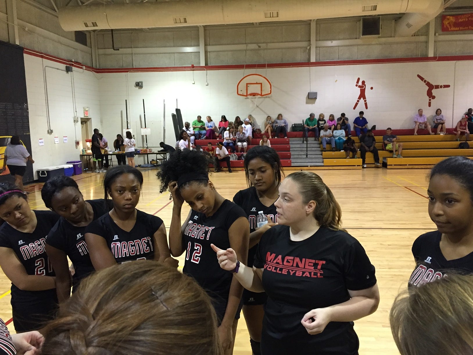 Caddo Magnet coach Amanda Dolph talks with her team prior to Tuesday's game with Captain Shreve.