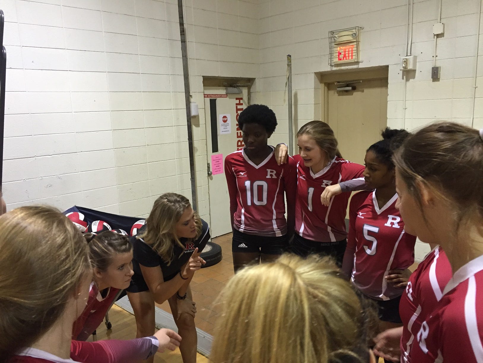 Ruston coach Amanda Cauley goes over points with her Lady Bearcats before their game Thursday at Caddo Magnet.