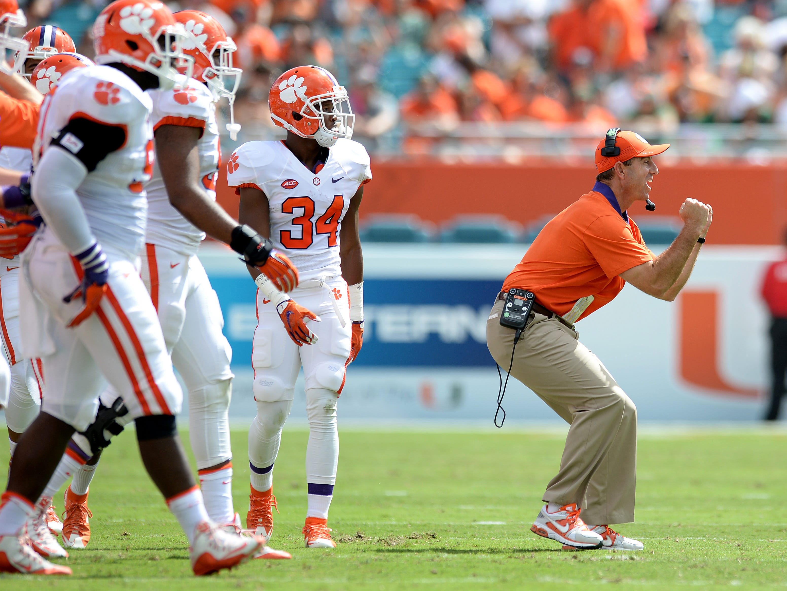 Clemson head coach Dabo Swinney reacts after a defensive stop against Miami during the 1st quarter Saturday, Oct. 24, 2015, in Miami Gardens, Fla.