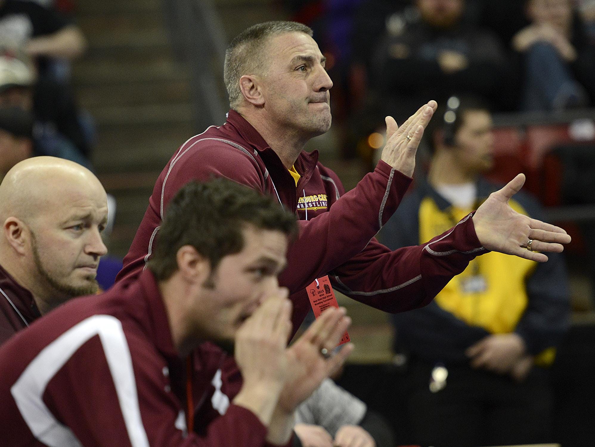 L-C coach Bob Berceau cheers on his son Mason during his match against Cuba City’s Josh Donar in their 138-pound Division 2 semifinal at the WIAA individual state wrestling tournament in February.