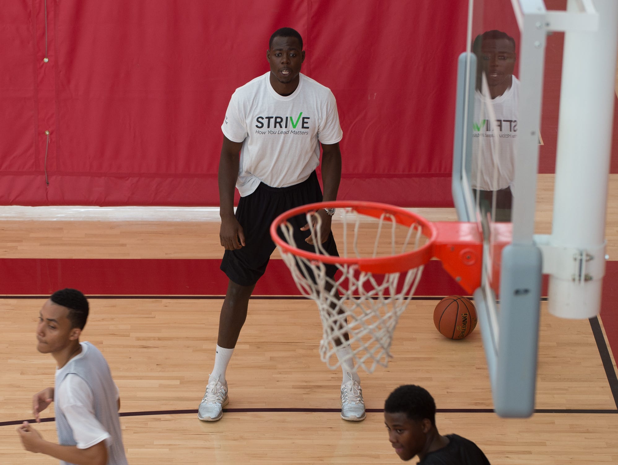St. Andrew's School alumni, Eric Boateng, working with basketball players during the Strive Sports Challenge at St. Andrew's School in Middletown, Del,.