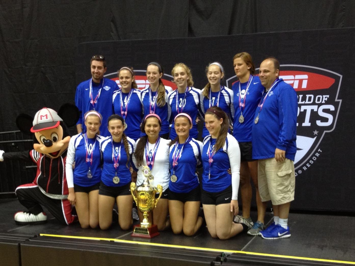 Tri-State Elite includes, from left: Top, Rob Courtney (assistant coach), Lydia Kurtz, Julia Sears, Hannah Keating, Caroline Kinney, Becca Refenes (coach), Kelly Crowley (club director); Bottom, Mickey Mouse, Gretchen Wessles, Gabby Ogle, Maggie Stuempel, Taylor Keener and Katie Draud.